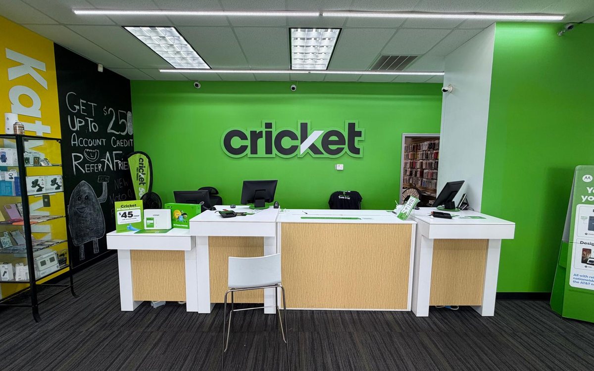 Inside a Cellular Planet store &ndash; service counter and Cricket Wireless wall